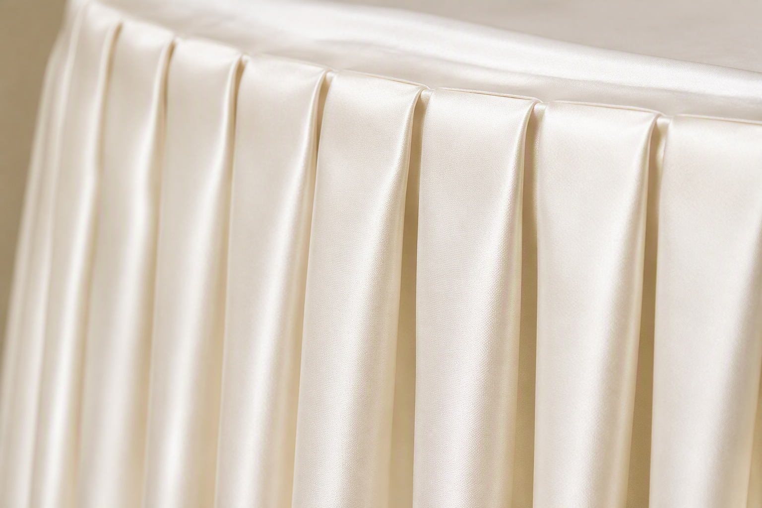 Close-up of pleated table skirt fabric with neat accordion box pleats