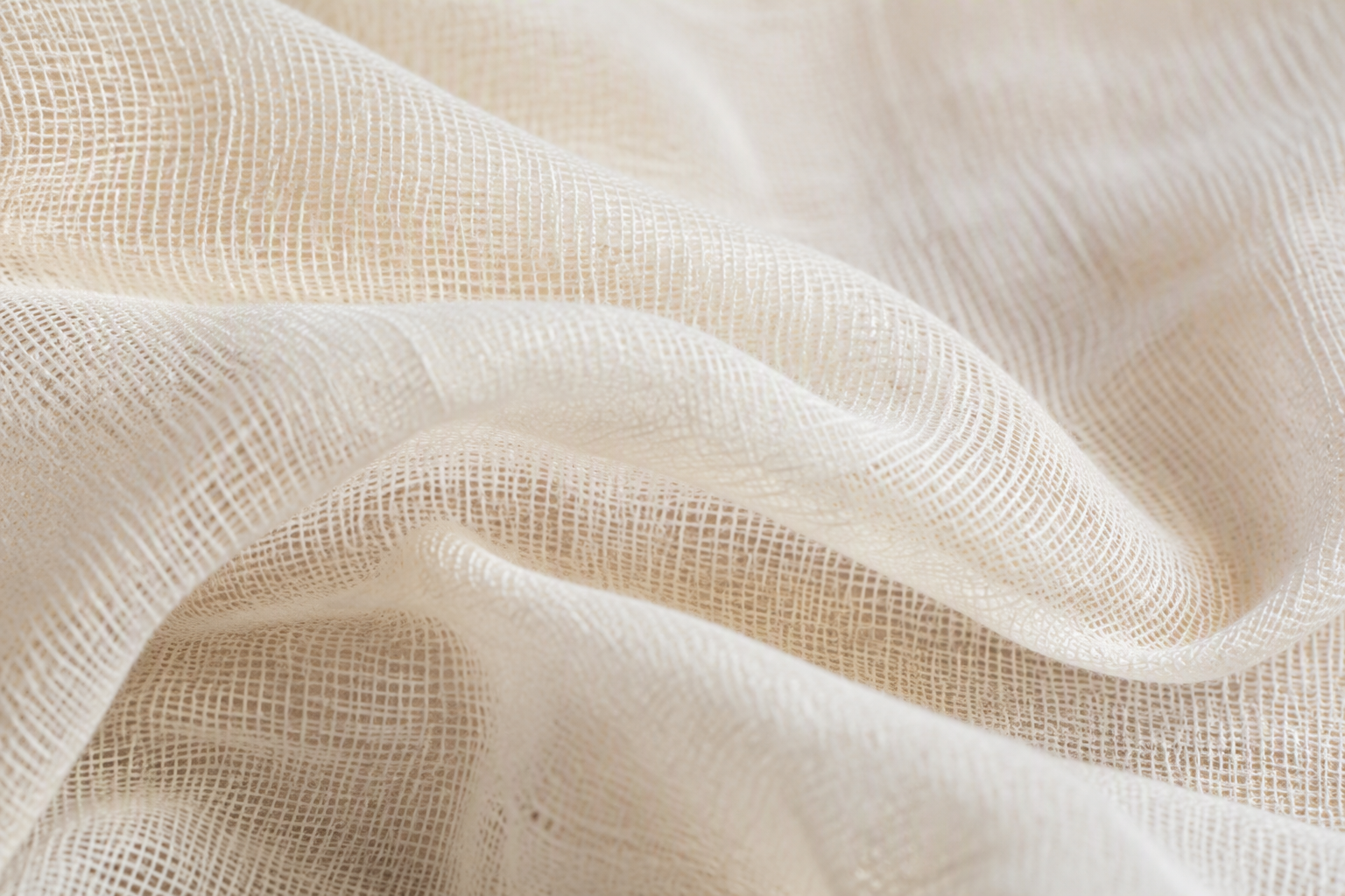 Macro close-up of double gauze fabric showing the sheer two-layer open weave