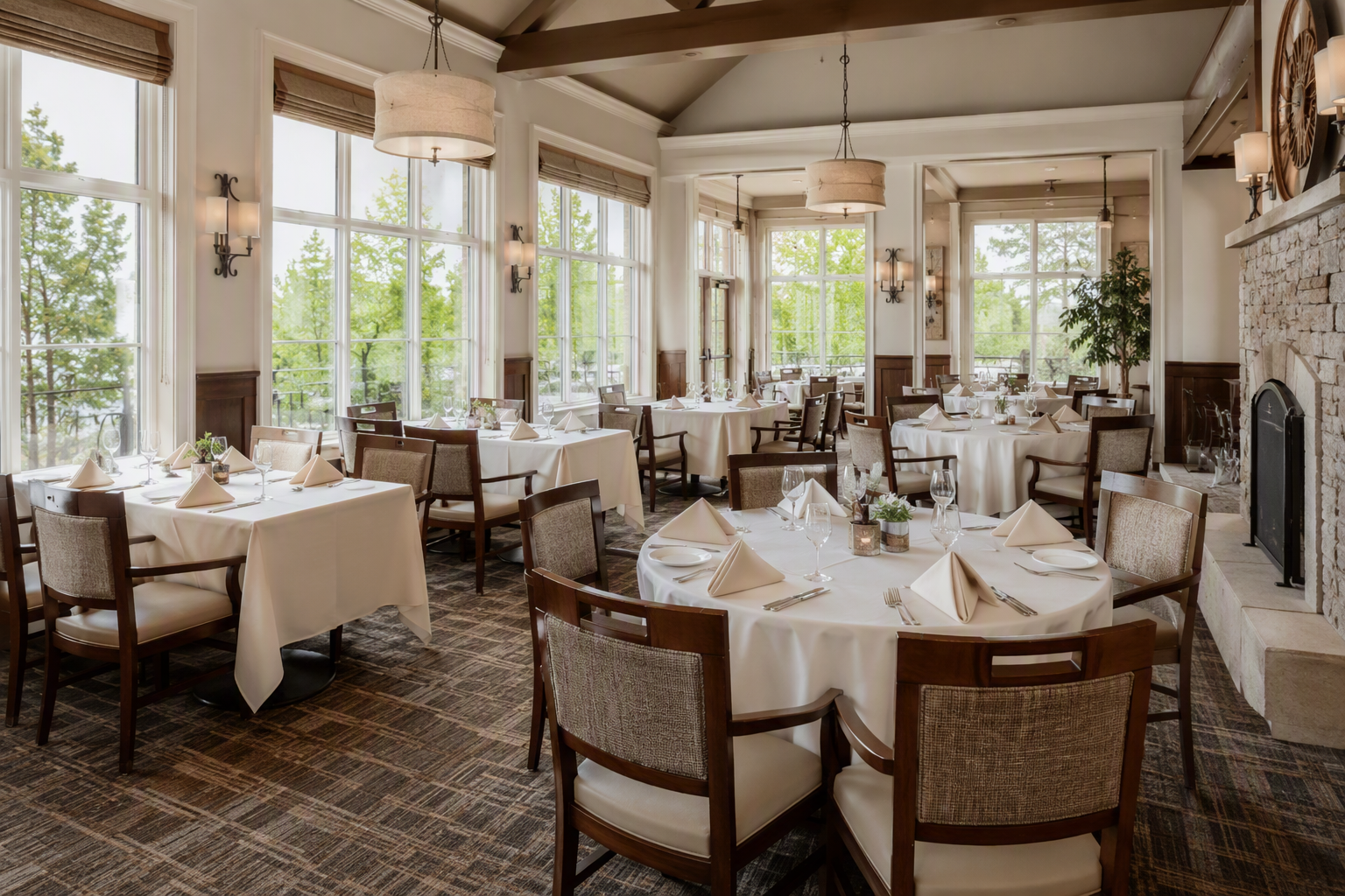 A dining room mixing rectangular and round tables, each with its own tablecloth size