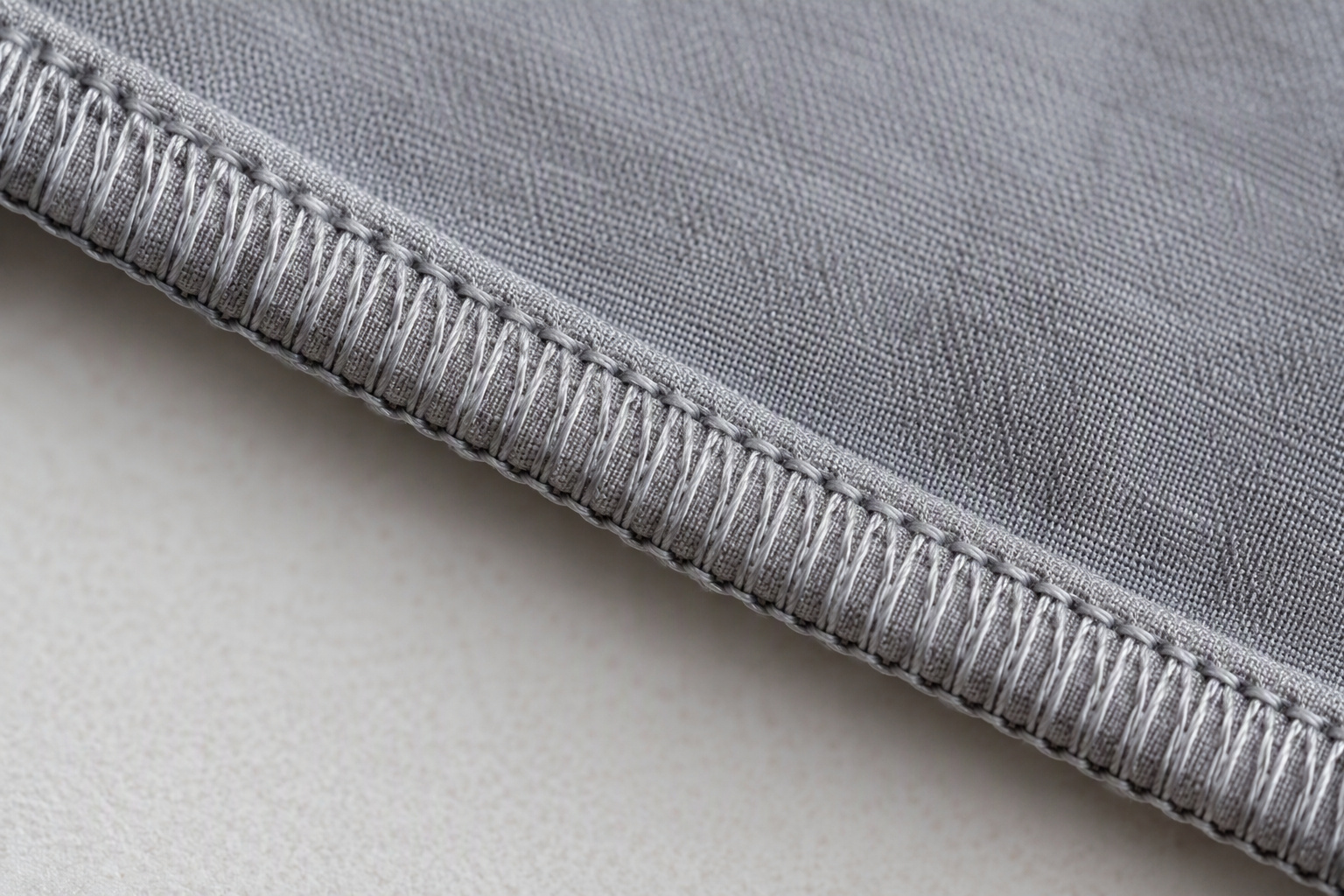 A clean machine serged hem on a tablecloth edge